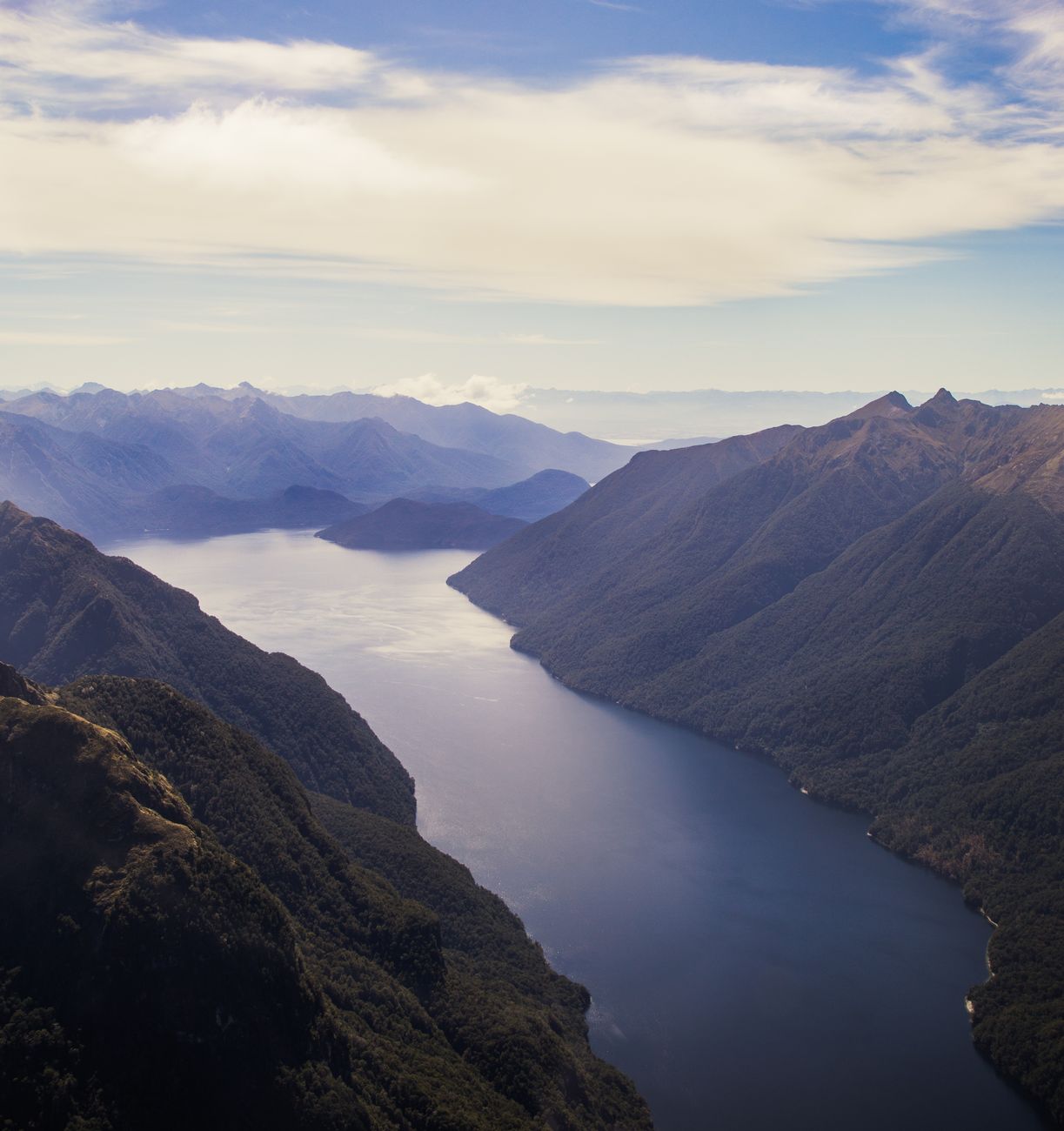 Exclusive traveler gazing at lake wakatipu queenstown new zealand